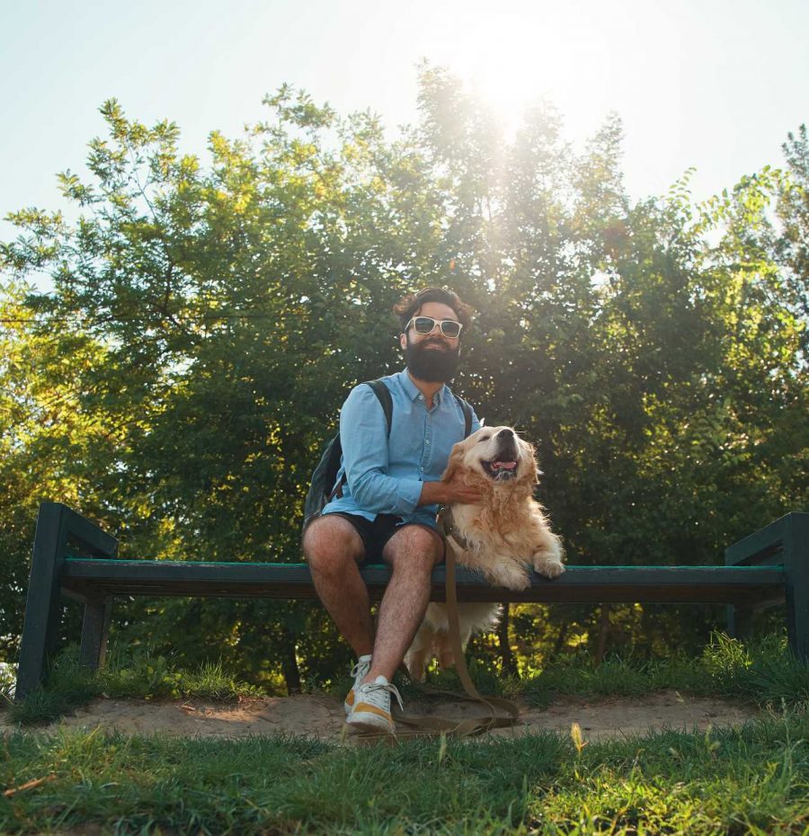 interesting-man-sitting-with-his-dog-on-the-chair-YLHBKUP.jpg